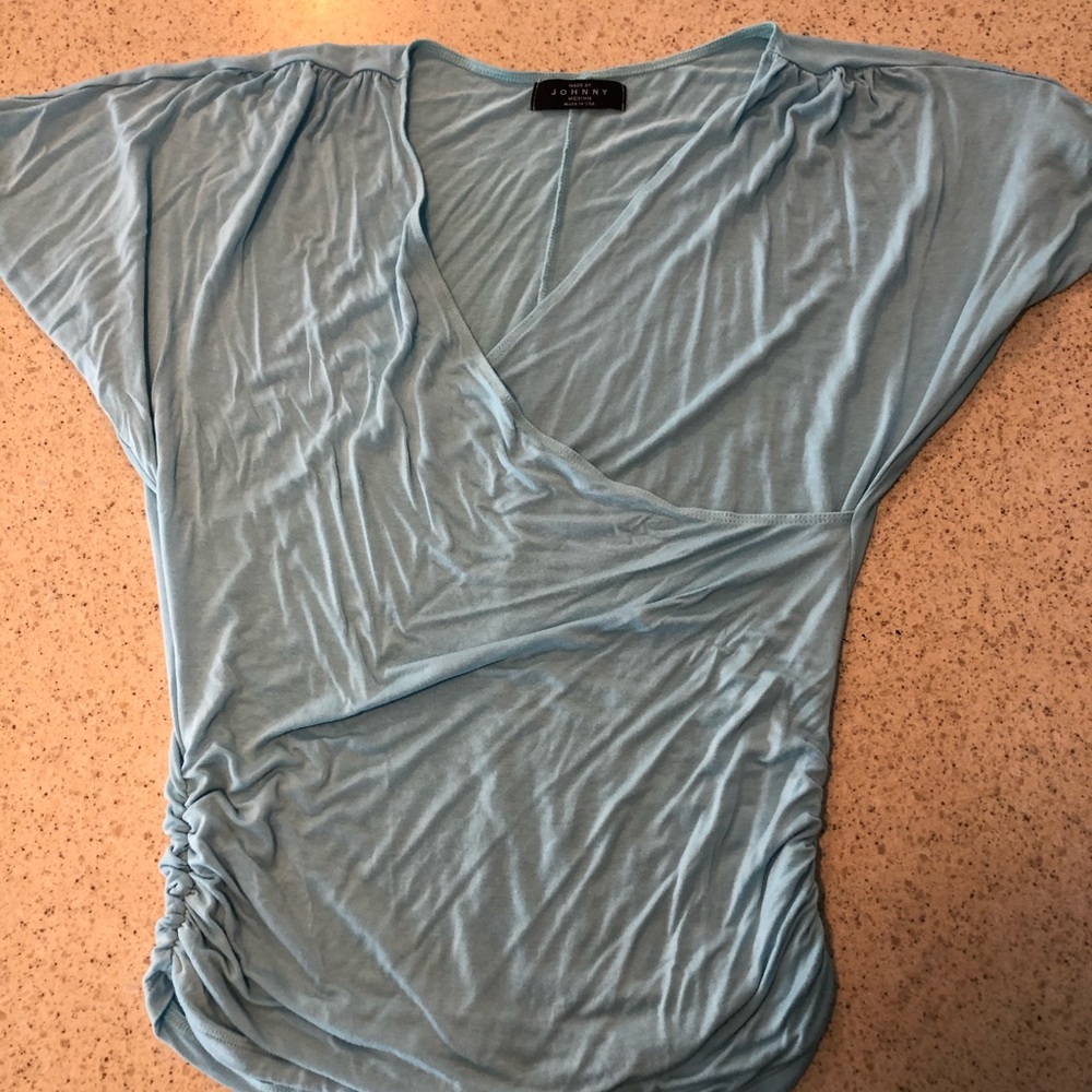 Light blue, ruched wrap top. Flattering.